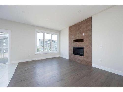 209 Siltstone Place, Fort Mcmurray, AB - Indoor Photo Showing Living Room With Fireplace