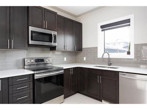 176 Siltstone Place, Fort Mcmurray, AB - Indoor Photo Showing Kitchen With Double Sink With Upgraded Kitchen