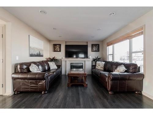 100 Warbler Avenue, Fort Mcmurray, AB - Indoor Photo Showing Living Room With Fireplace