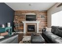 135 Crane Place, Fort Mcmurray, AB  - Indoor Photo Showing Living Room With Fireplace 