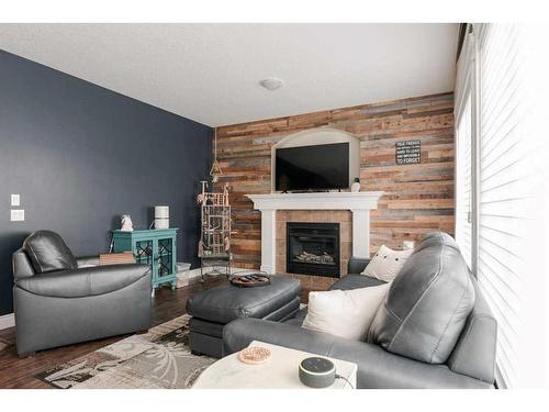 135 Crane Place, Fort Mcmurray, AB - Indoor Photo Showing Living Room With Fireplace