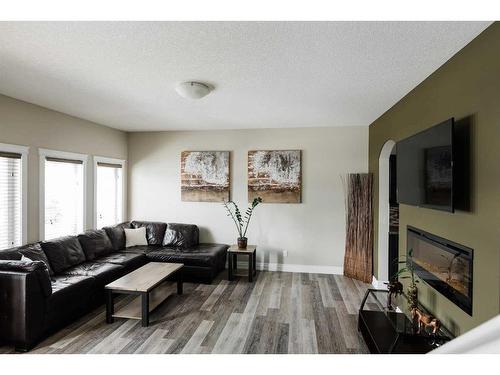 9-300 Sparrow Hawk Drive, Fort Mcmurray, AB - Indoor Photo Showing Living Room With Fireplace