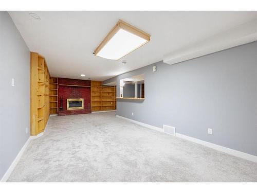 15 Maciver Street, Fort Mcmurray, AB - Indoor Photo Showing Other Room With Fireplace