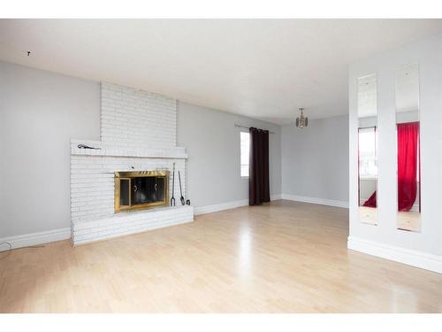 15 Maciver Street, Fort Mcmurray, AB - Indoor Photo Showing Living Room With Fireplace