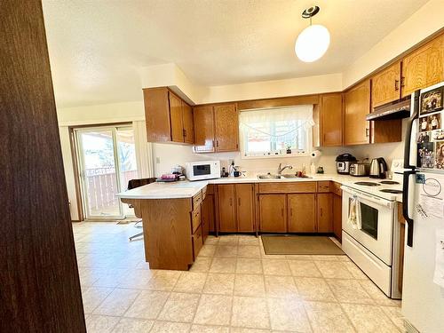 9607 94 Street, Lac La Biche, AB - Indoor Photo Showing Kitchen With Double Sink