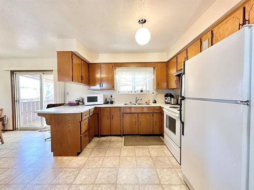 9607 94 Street, Lac La Biche, AB - Indoor Photo Showing Kitchen With Double Sink