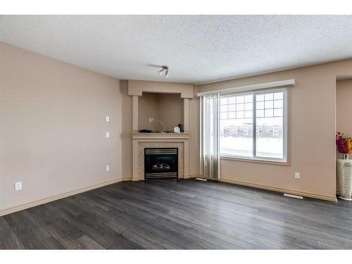346 Grosbeak Way, Fort Mcmurray, AB - Indoor Photo Showing Living Room With Fireplace