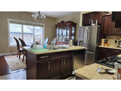 6-300 Sparrow Hawk Drive, Fort Mcmurray, AB - Indoor Photo Showing Kitchen With Stainless Steel Kitchen With Double Sink