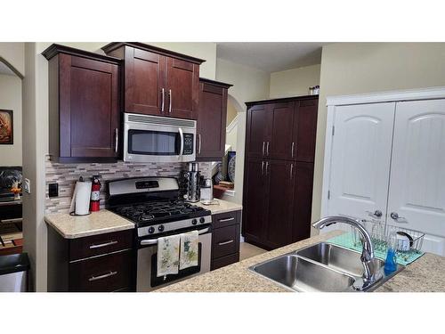 6-300 Sparrow Hawk Drive, Fort Mcmurray, AB - Indoor Photo Showing Kitchen With Double Sink
