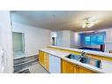 203-10101 Morrison Street, Fort Mcmurray, AB  - Indoor Photo Showing Kitchen With Double Sink 