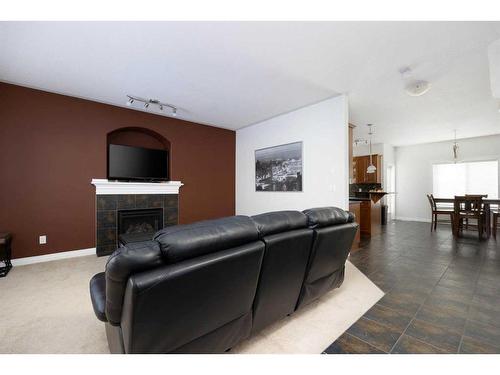 148 Grosbeak Way, Fort Mcmurray, AB - Indoor Photo Showing Living Room With Fireplace