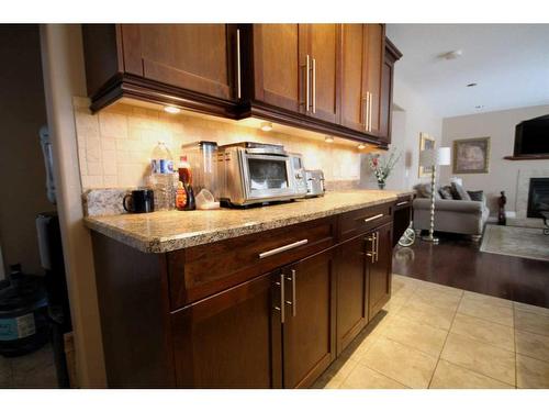 108 Grebe Road, Fort Mcmurray, AB - Indoor Photo Showing Kitchen With Fireplace