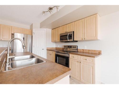18-240 Laffont Way, Fort Mcmurray, AB - Indoor Photo Showing Kitchen With Stainless Steel Kitchen With Double Sink