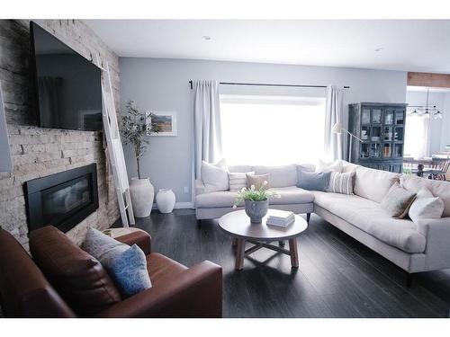 209 Blackburn Drive, Fort Mcmurray, AB - Indoor Photo Showing Living Room With Fireplace