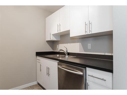 334-201 Abasand Drive, Fort Mcmurray, AB - Indoor Photo Showing Kitchen With Double Sink