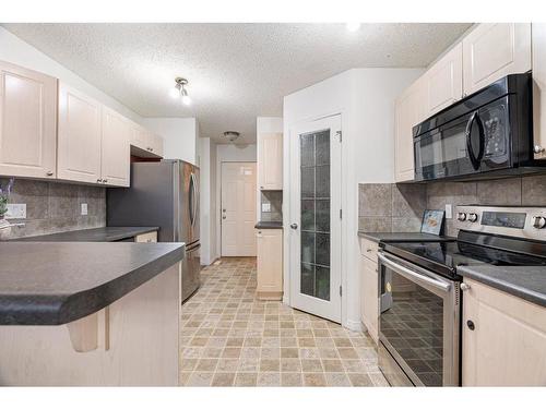 153 Cinnamon Street, Fort Mcmurray, AB - Indoor Photo Showing Kitchen