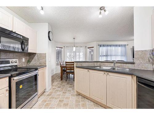 153 Cinnamon Street, Fort Mcmurray, AB - Indoor Photo Showing Kitchen With Double Sink