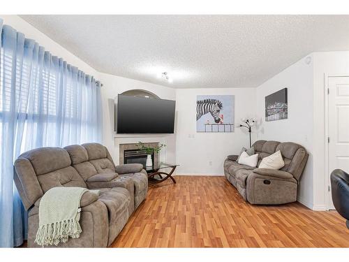 153 Cinnamon Street, Fort Mcmurray, AB - Indoor Photo Showing Living Room With Fireplace