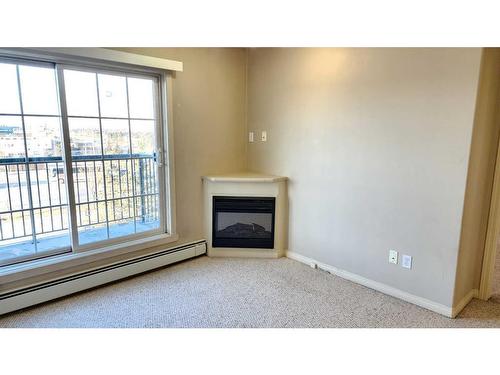 1411-200 Lougheed Drive, Fort Mcmurray, AB - Indoor With Fireplace