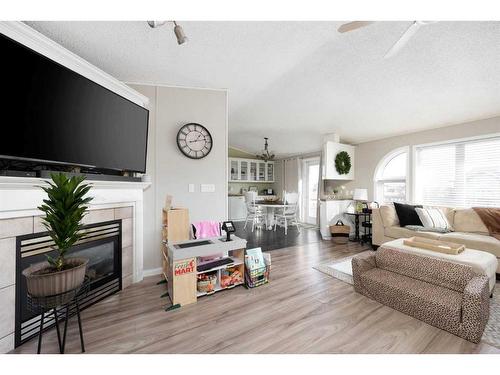 100 Ash Way, Fort Mcmurray, AB - Indoor Photo Showing Living Room With Fireplace