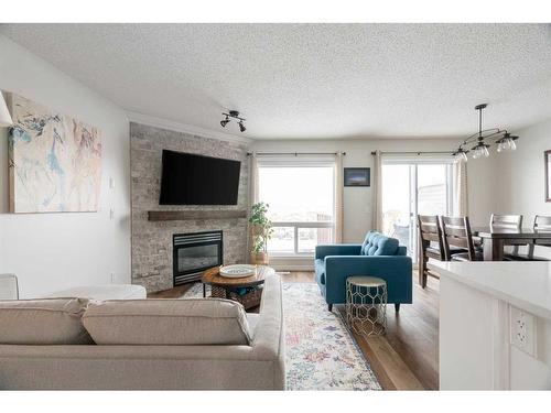 145 Sandstone Lane, Fort Mcmurray, AB - Indoor Photo Showing Living Room With Fireplace
