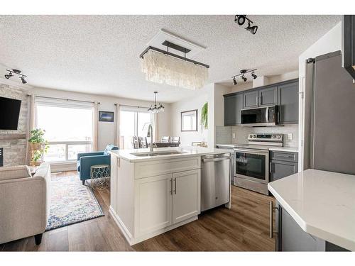 145 Sandstone Lane, Fort Mcmurray, AB - Indoor Photo Showing Kitchen With Fireplace
