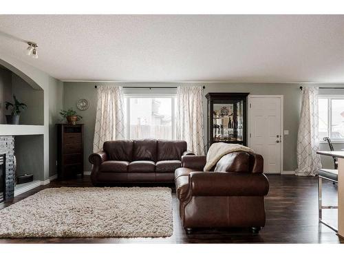 146 Iris Way, Fort Mcmurray, AB - Indoor Photo Showing Living Room With Fireplace