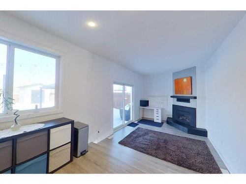 158 Maclaren Crescent, Fort Mcmurray, AB - Indoor Photo Showing Other Room With Fireplace