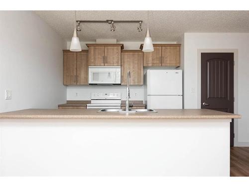 1304-135A Sandpiper Road, Fort Mcmurray, AB - Indoor Photo Showing Kitchen With Double Sink