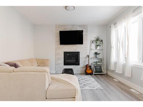113 Garson Place, Fort Mcmurray, AB - Indoor Photo Showing Living Room With Fireplace