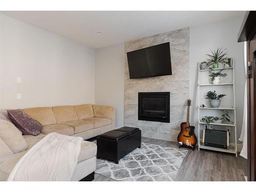 113 Garson Place, Fort Mcmurray, AB - Indoor Photo Showing Living Room With Fireplace