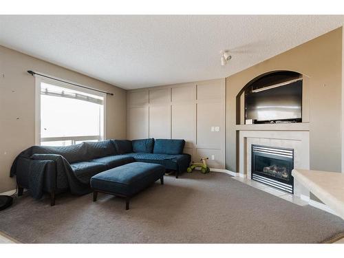 179 Bear Paw Drive, Fort Mcmurray, AB - Indoor Photo Showing Living Room With Fireplace