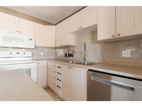 179 Bear Paw Drive, Fort Mcmurray, AB - Indoor Photo Showing Kitchen With Double Sink