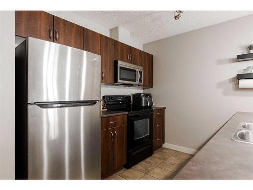 115-136B Sandpiper Road, Fort Mcmurray, AB - Indoor Photo Showing Kitchen With Double Sink