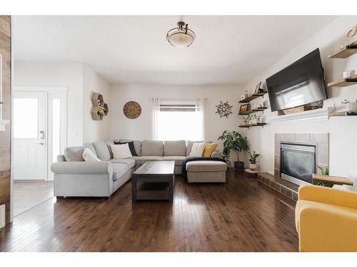 128 Coyote Crescent, Fort Mcmurray, AB - Indoor Photo Showing Living Room With Fireplace