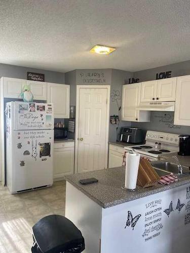 271,275,279,283,287 Mustang Road, Fort Mcmurray, AB - Indoor Photo Showing Kitchen