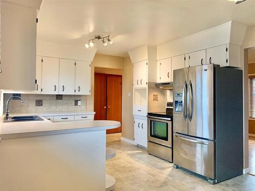 10312 101 A Ave., Lac La Biche, AB - Indoor Photo Showing Kitchen With Stainless Steel Kitchen With Double Sink