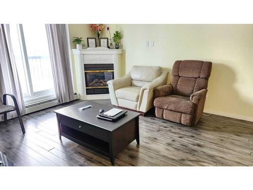 203-100 Richard Street, Fort Mcmurray, AB - Indoor Photo Showing Living Room With Fireplace