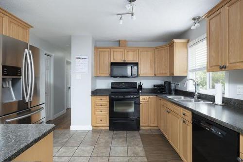 138 Cochrane Crescent, Fort Mcmurray, AB - Indoor Photo Showing Kitchen With Double Sink