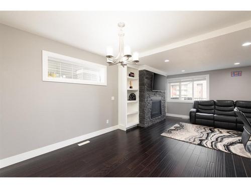 149 Siltstone Place, Fort Mcmurray, AB - Indoor Photo Showing Living Room With Fireplace