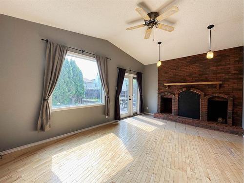 148 Beaton Place, Fort Mcmurray, AB - Indoor Photo Showing Living Room With Fireplace