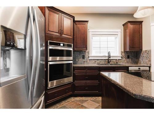 128 Elderberry Street, Fort Mcmurray, AB - Indoor Photo Showing Kitchen With Double Sink