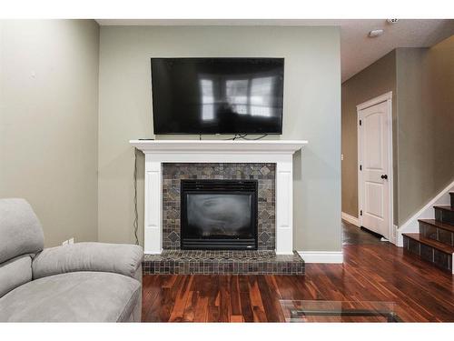 128 Elderberry Street, Fort Mcmurray, AB - Indoor Photo Showing Living Room With Fireplace