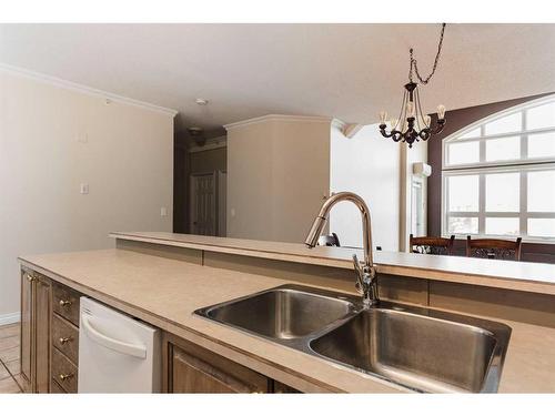 403-10101 Morrison Street, Fort Mcmurray, AB - Indoor Photo Showing Kitchen With Double Sink
