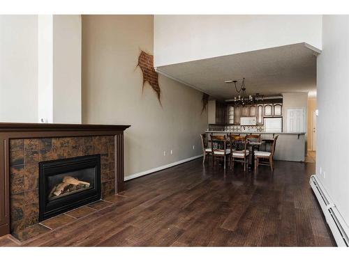 403-10101 Morrison Street, Fort Mcmurray, AB - Indoor Photo Showing Other Room With Fireplace