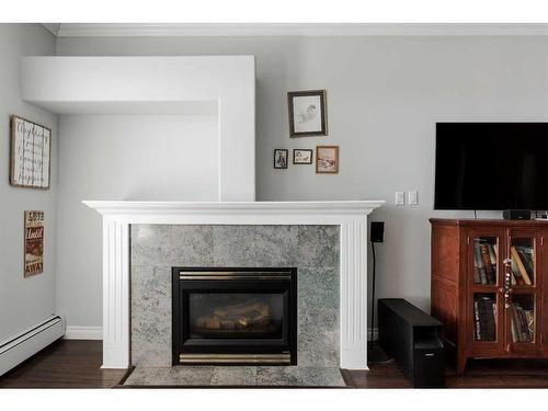 307-10101 Morrison Street, Fort Mcmurray, AB - Indoor Photo Showing Living Room With Fireplace