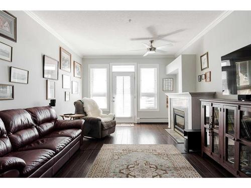 307-10101 Morrison Street, Fort Mcmurray, AB - Indoor Photo Showing Living Room With Fireplace
