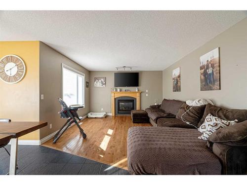 147 Lazarde Place, Fort Mcmurray, AB - Indoor Photo Showing Living Room With Fireplace