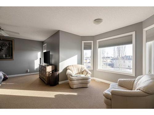 147 Lazarde Place, Fort Mcmurray, AB - Indoor Photo Showing Bedroom With Fireplace