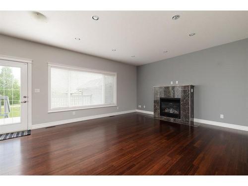 201 Chestnut Way, Fort Mcmurray, AB - Indoor Photo Showing Living Room With Fireplace